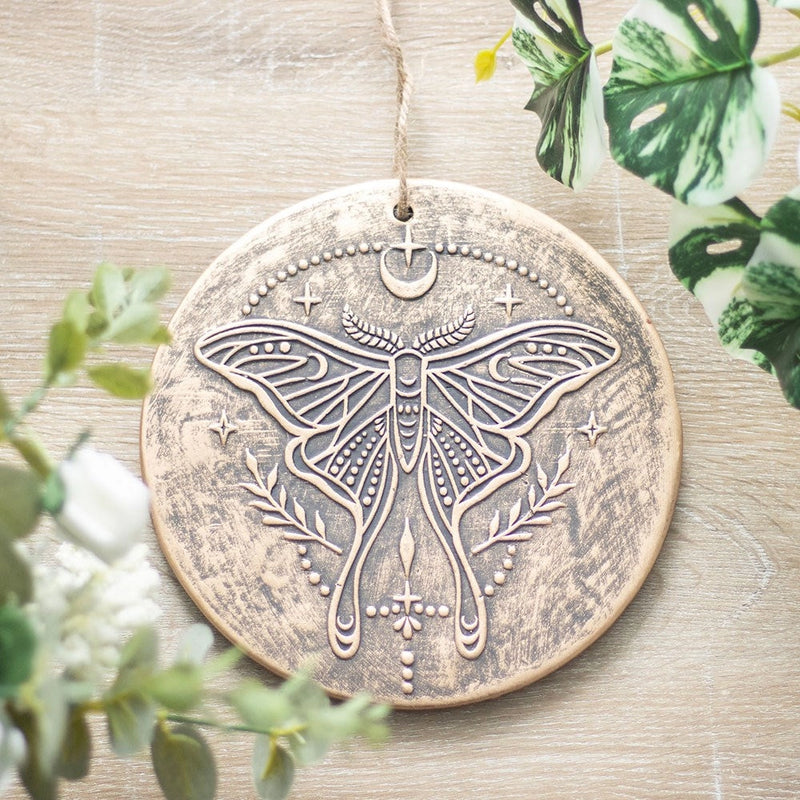 Plaque murale décorative en terre cuite – Motif Papillon Lunaire et symboles célestes – Effet bronze vieilli