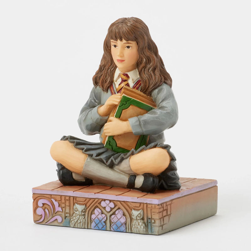 Figurine Harry Potter by Jim Shore – Hermione Granger assise avec ses livres