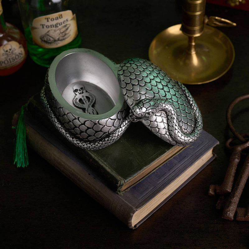 Boite Harry Potter ouverte ur une pile de livres