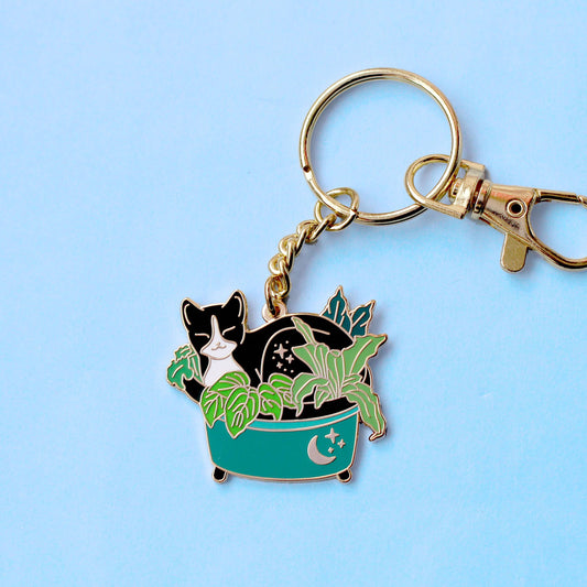 Porte-clés – Chat noir dans les plantes