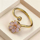 Bague anti-stress fleur violette rotative plaqué or – Ajustable