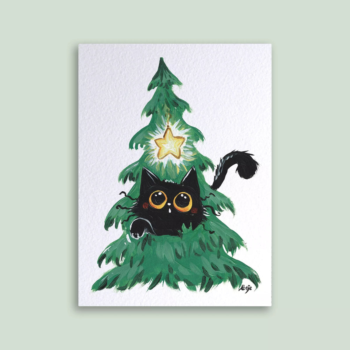 Carte postale – Chat noir dans un sapin de Noël