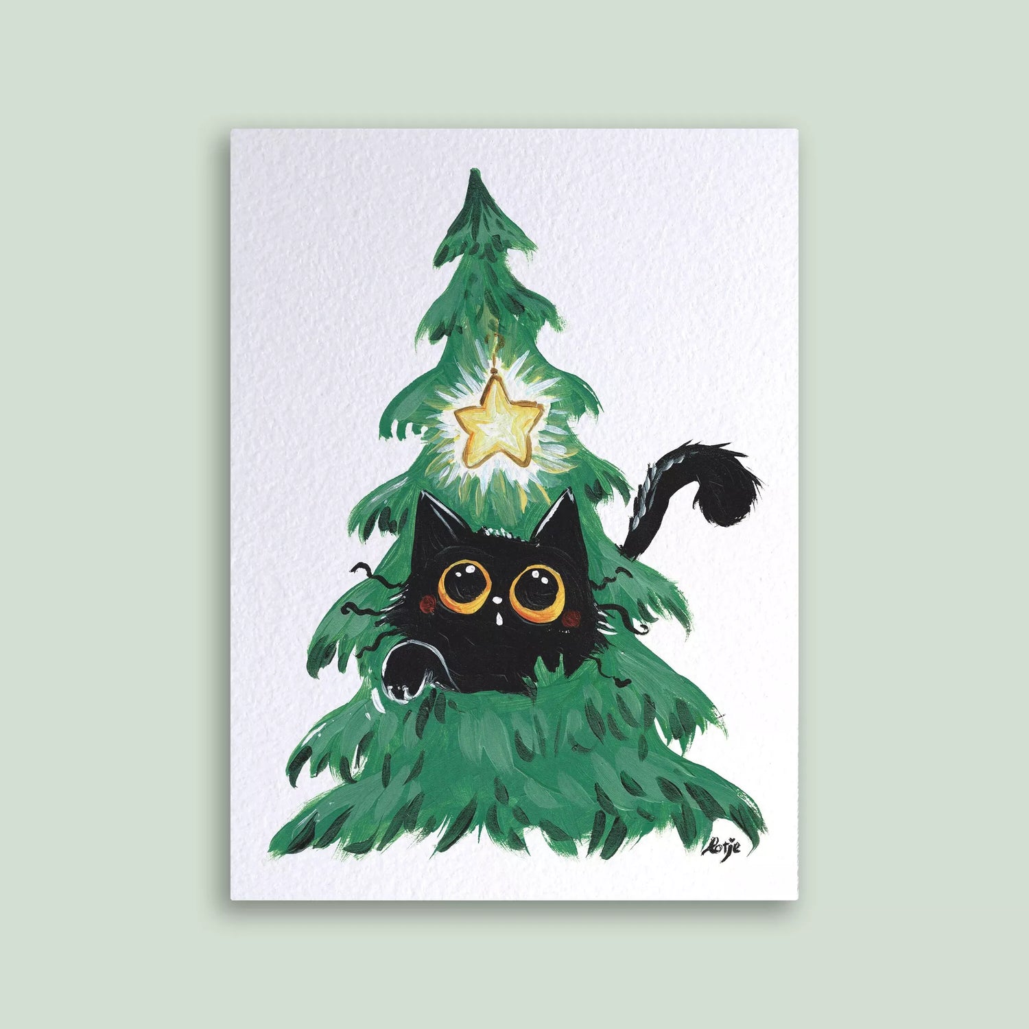 Carte postale – Chat noir dans un sapin de Noël