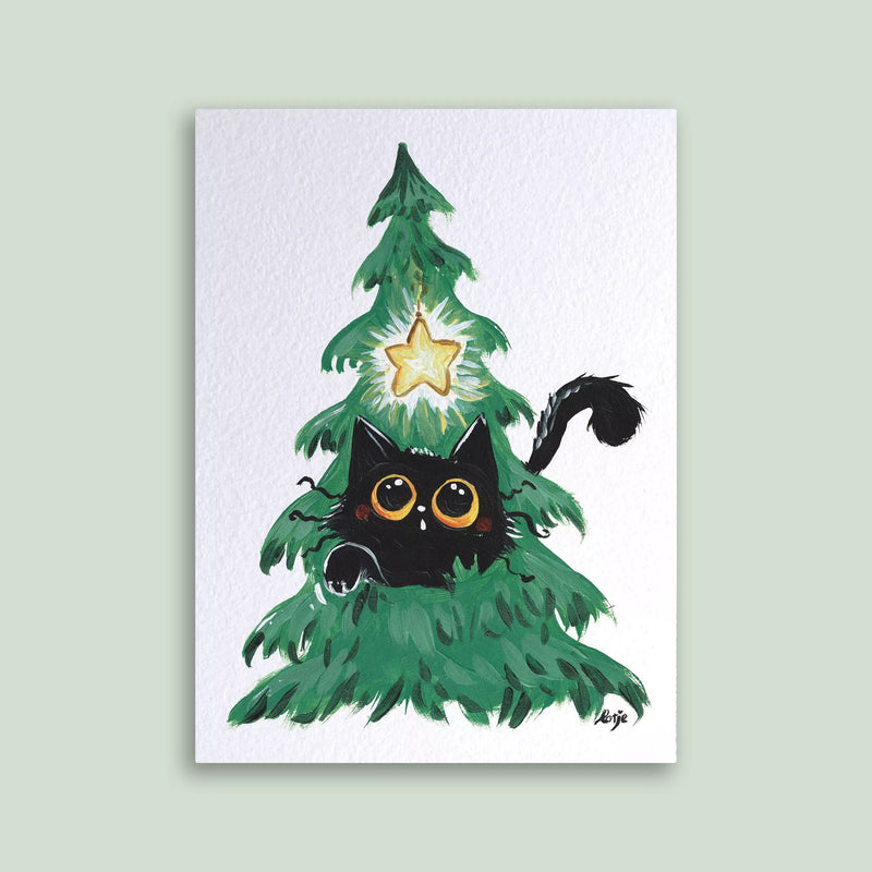 Carte postale – Chat noir dans un sapin de Noël