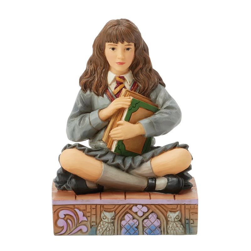 Figurine Harry Potter by Jim Shore – Hermione Granger assise avec ses livres