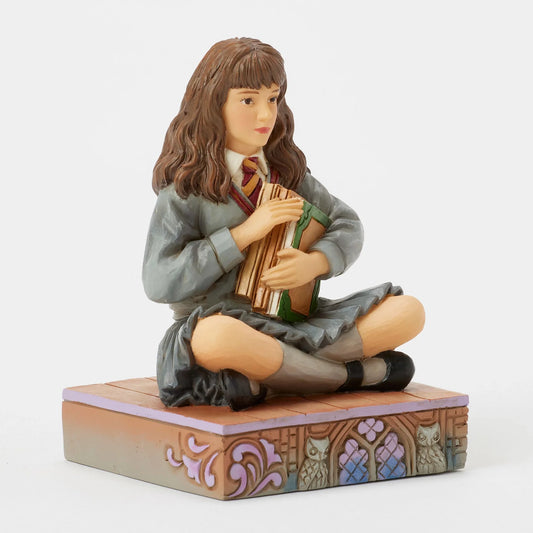 Figurine Harry Potter by Jim Shore – Hermione Granger assise avec ses livres