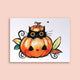Carte postale – Chat noir dans une citrouille