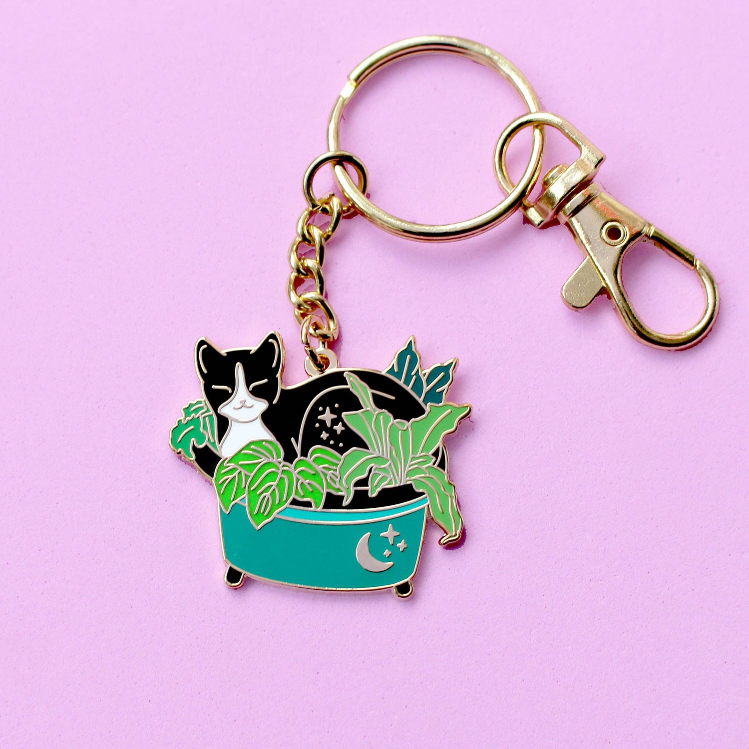 Porte-clés – Chat noir dans les plantes