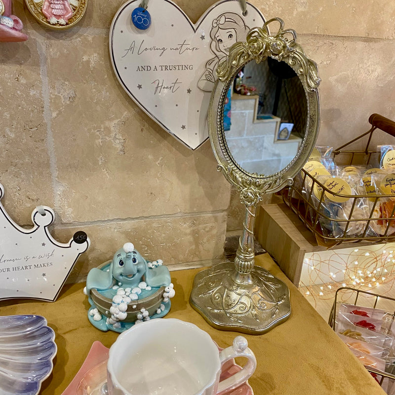 Miroir sur pied style baroque argenté doré