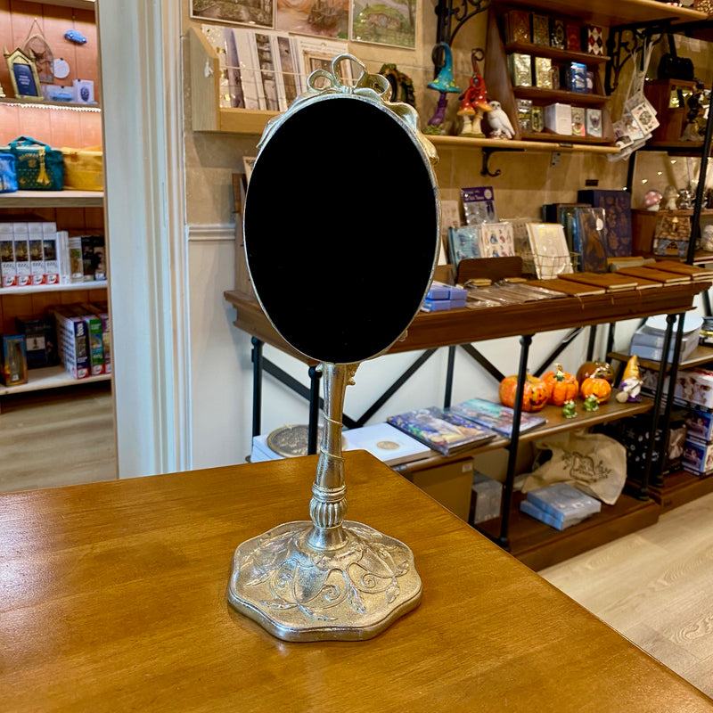 Miroir sur pied style baroque argenté doré