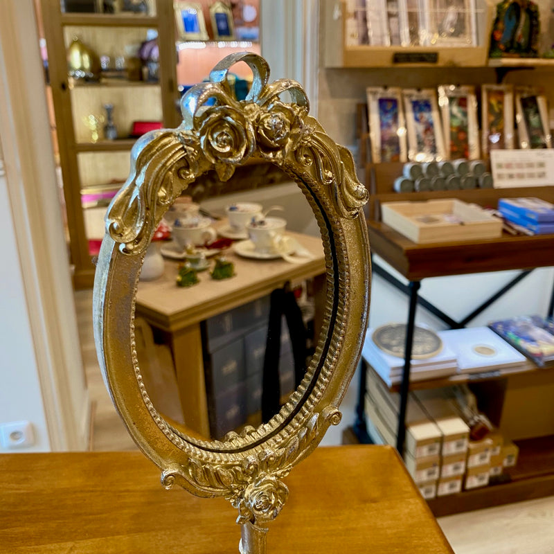 Miroir sur pied style baroque argenté doré